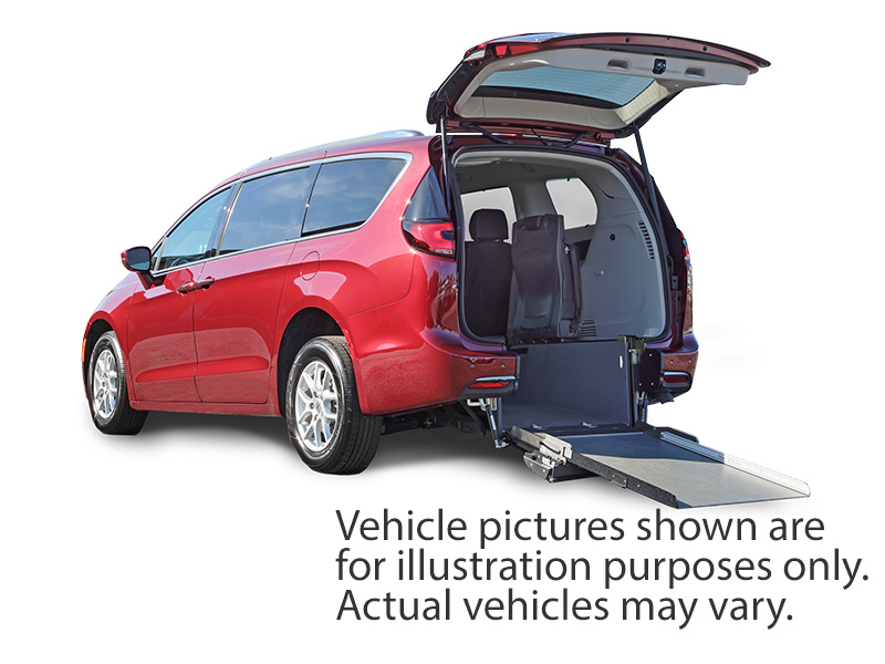 White Chrysler Voyager with Rear Entry Manual Fold Out ramp